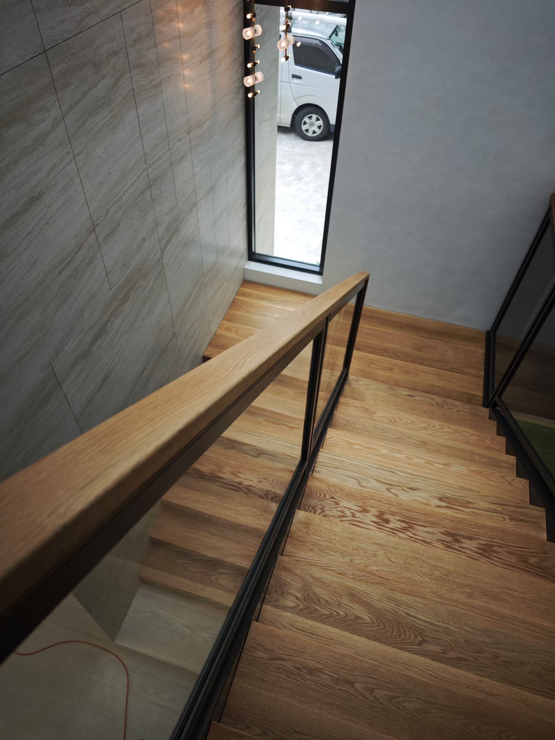 Timber staircase viewed from above with oak handrail
