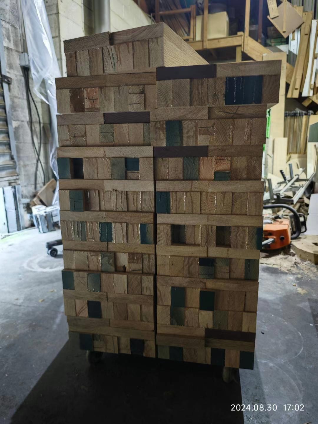 Timber slat staircase divider being installed