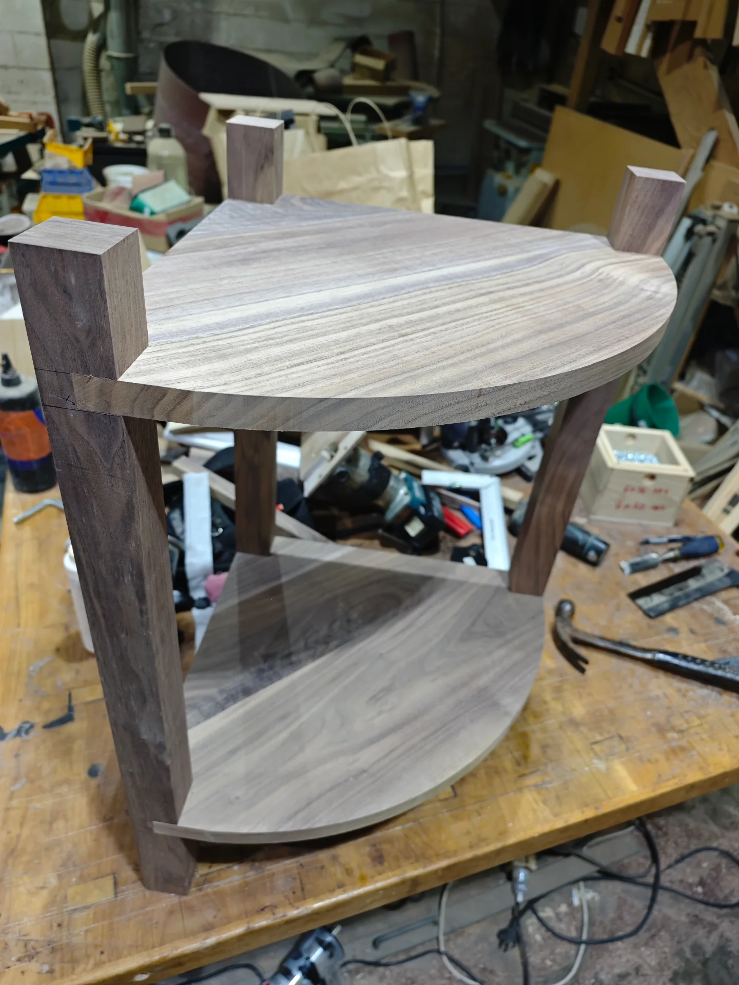 Black walnut corner table standing in dry assembly before finishing