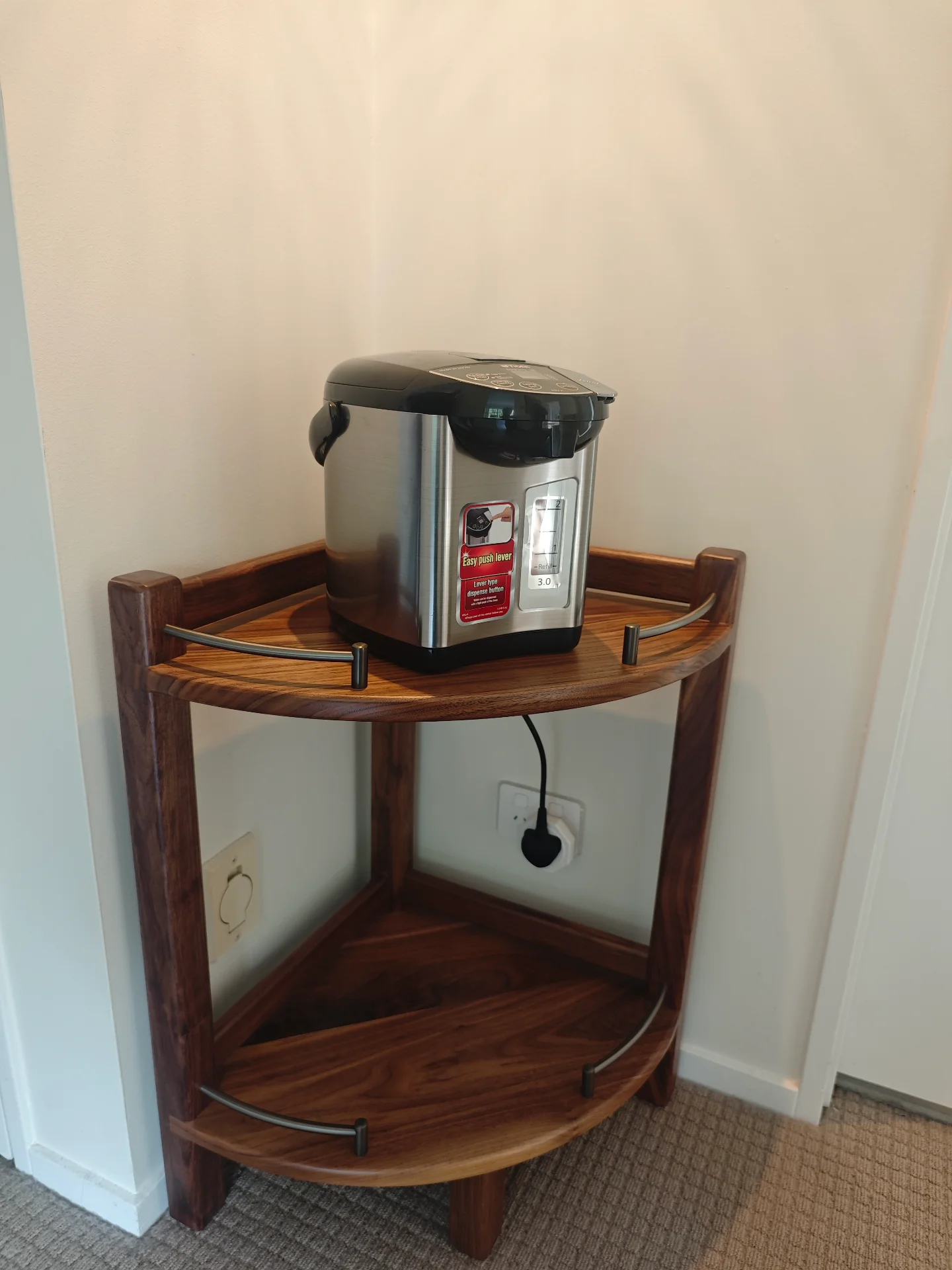 Finished black walnut corner table installed in a home