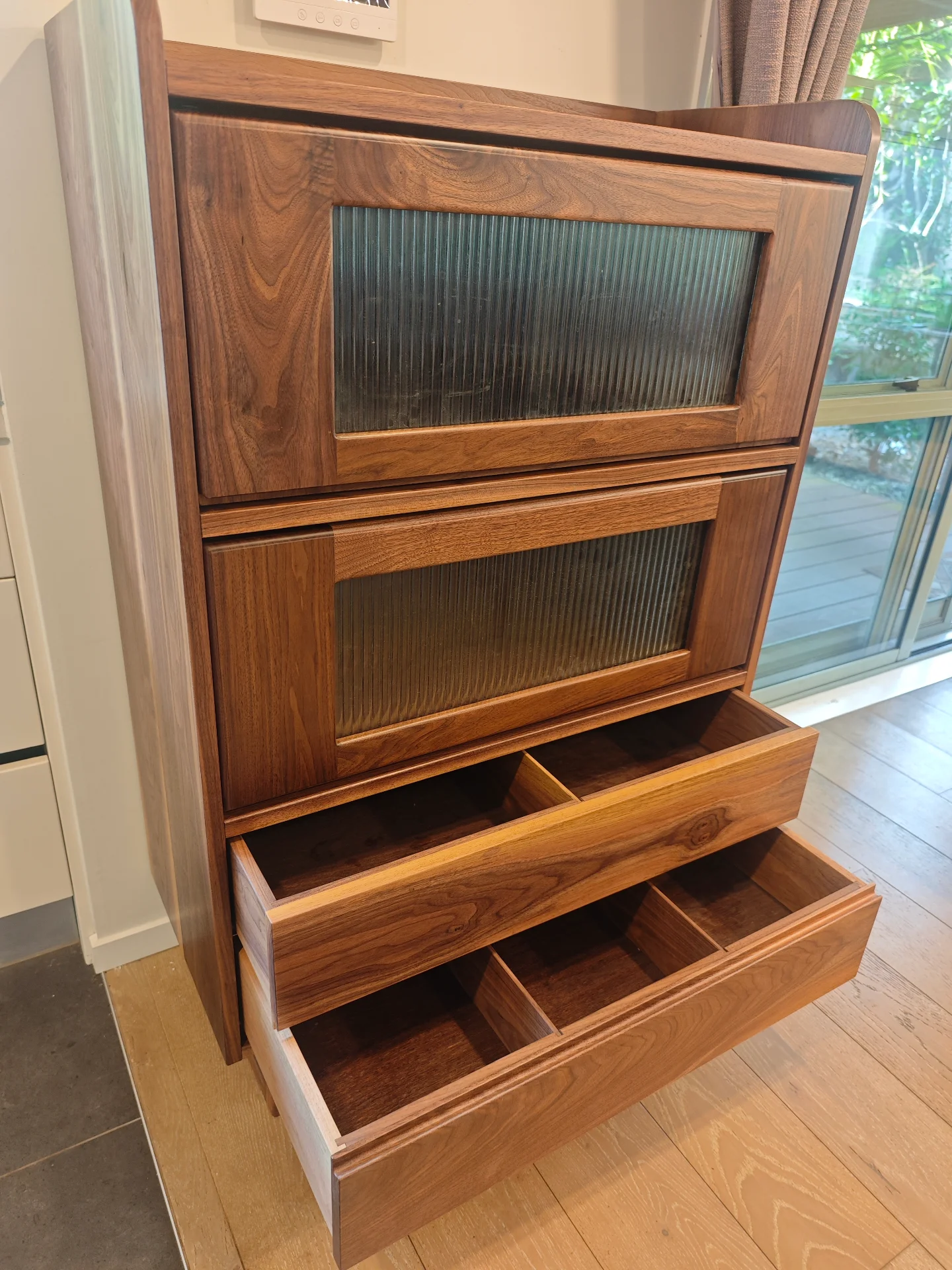 Open walnut drawer with divided internal storage
